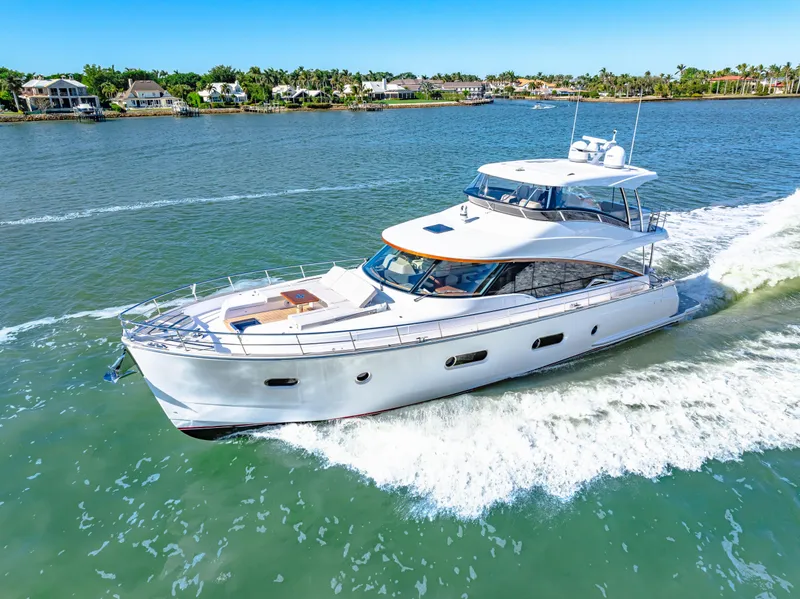 Slide: The Image of 2025 Belize 66 Daybridge yacht cruising on a sunny day in a scenic waterway. - 32