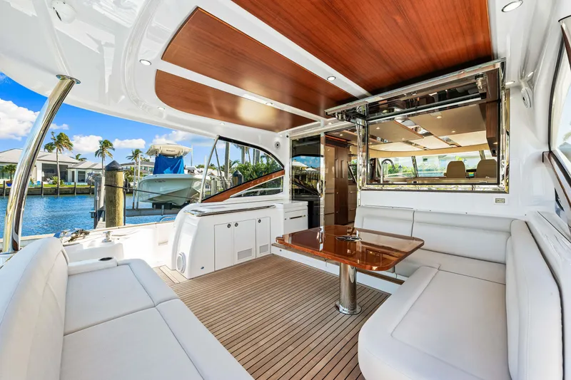 Slide: The Image of Luxurious interior of 2025 Belize 66 Daybridge yacht with elegant seating and wooden accents. - 33