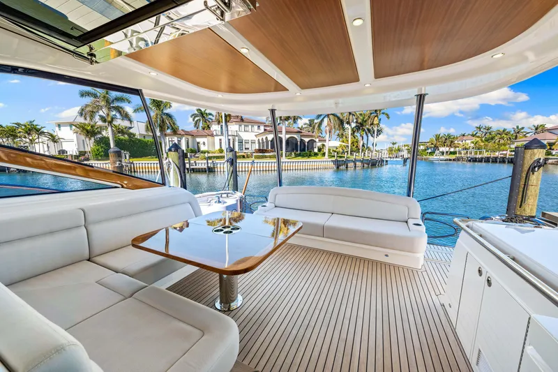 Slide: The Image of Luxurious 2025 Belize 66 Daybridge yacht interior with elegant seating and scenic waterfront view. - 36