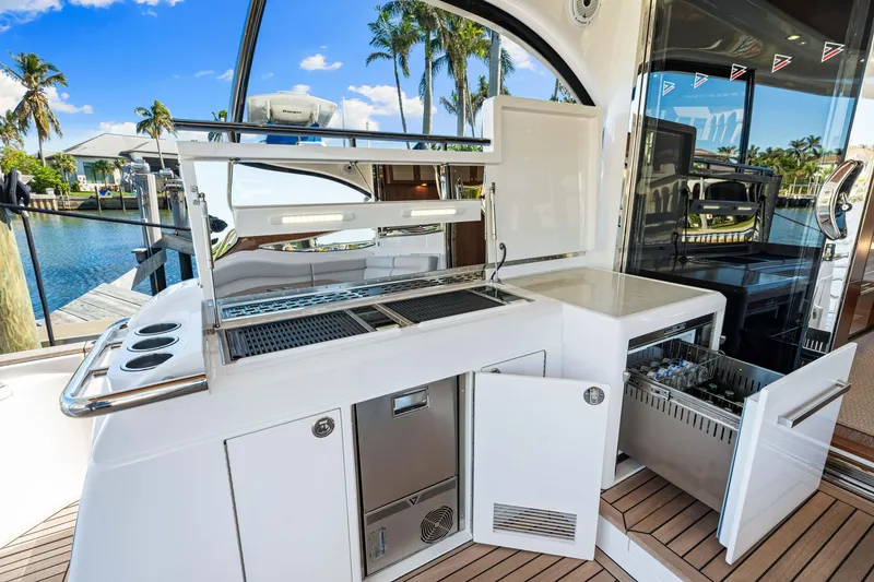 Slide: The Image of Outdoor kitchen on 2025 Belize 66 Daybridge yacht, featuring grill and dishwasher. - 38