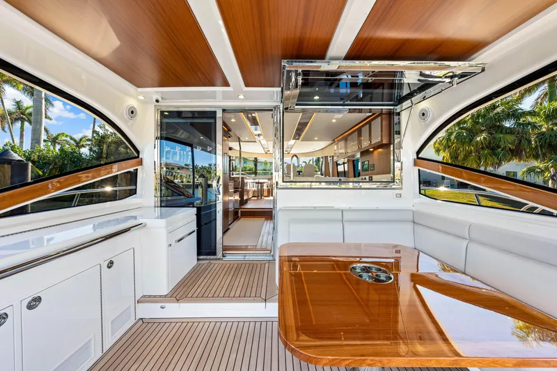 Slide: The Image of Luxurious interior of 2025 Belize 66 Daybridge yacht with elegant wood finishes and spacious seating. - 48