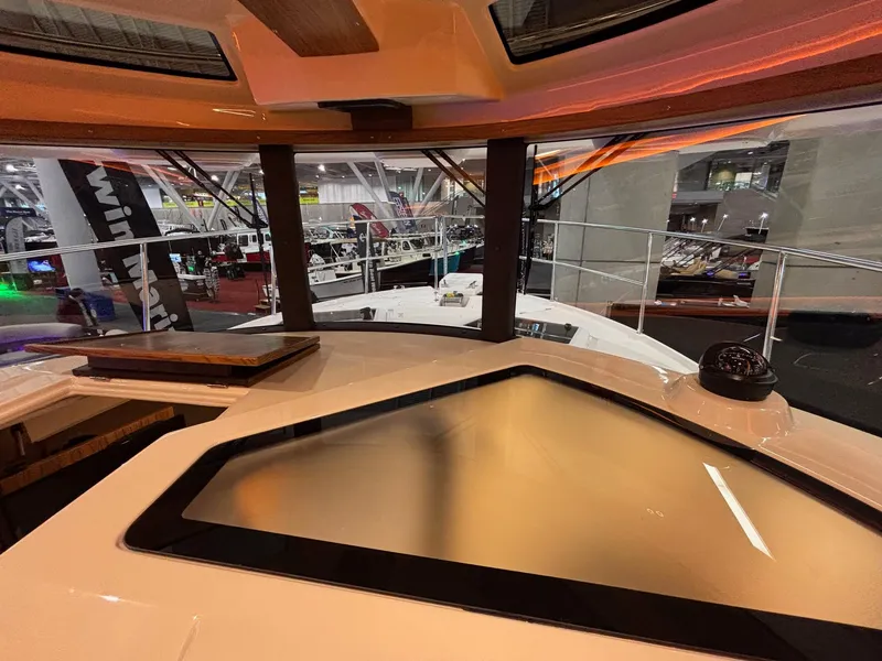 Slide: The Image of Interior view of 2025 Ranger Tugs R-29 S boat, showcasing modern design and panoramic windows. - 20