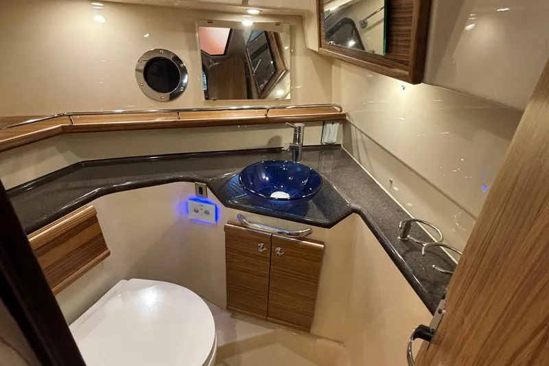 Slide: The Image of Luxurious bathroom in 2025 Ranger Tugs R-29 S with modern fixtures and elegant design. - 22