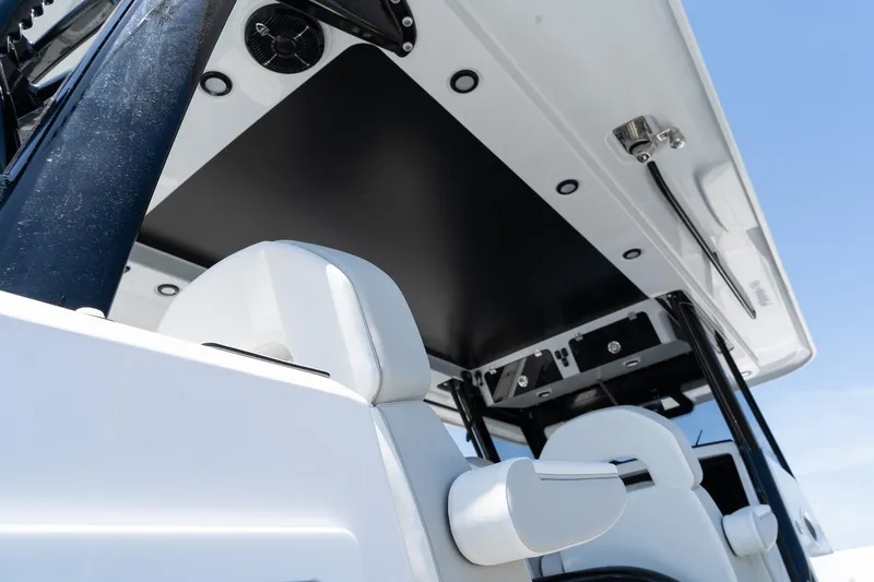 Slide: The Image of 2025 Twin Vee 400 GFX2 CC boat interior with modern seating and sleek design. - 17
