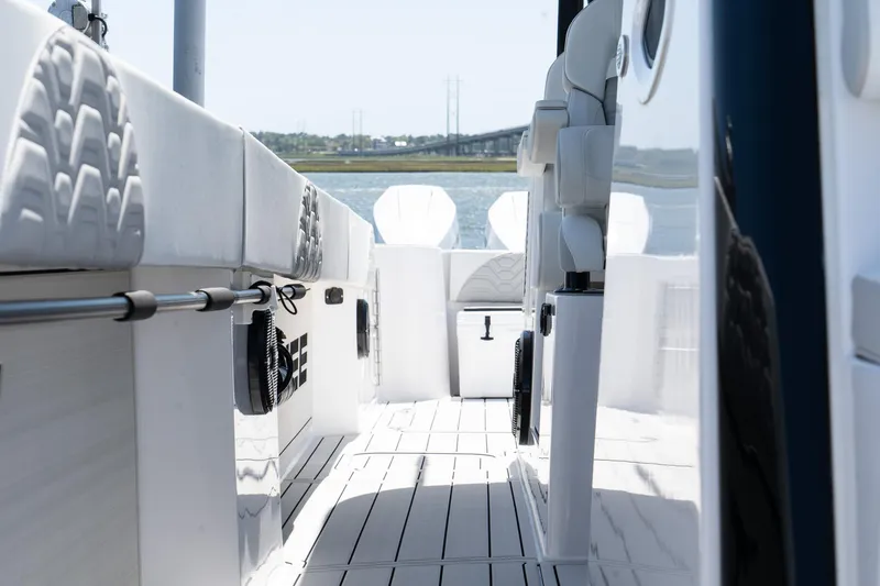 Slide: The Image of 2025 Twin Vee 400 GFX2 CC boat interior with sleek white seating and modern design. - 30