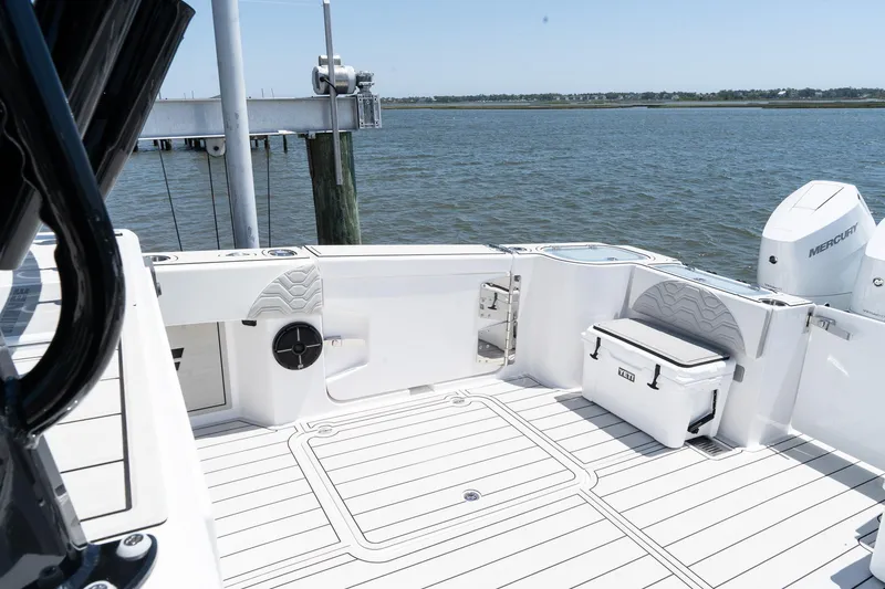 Slide: The Image of 2025 Twin Vee 400 GFX2 CC boat deck, featuring spacious seating and modern design. - 38