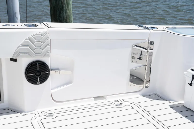 Slide: The Image of 2025 Twin Vee 400 GFX2 CC boat interior, featuring sleek white design and speaker. - 39