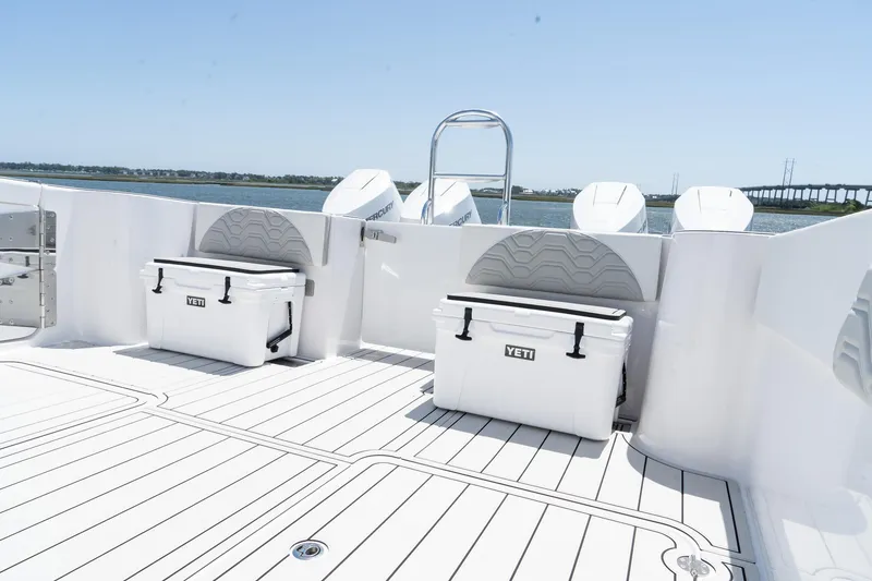 Slide: The Image of 2025 Twin Vee 400 GFX2 CC boat deck with Yeti coolers and seating. - 43