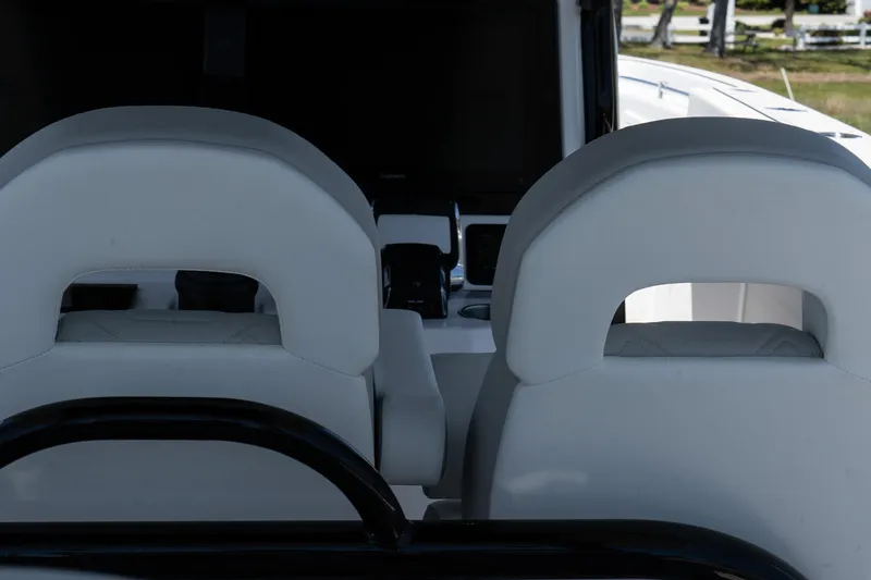 Slide: The Image of 2025 Twin Vee 400 GFX2 CC boat interior with modern seating design. - 49