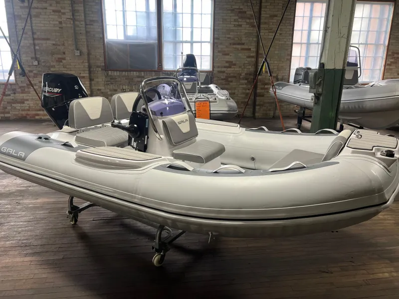 The Image of Top view of 2026 Gala V330 inflatable boat with seating and steering console. - 0