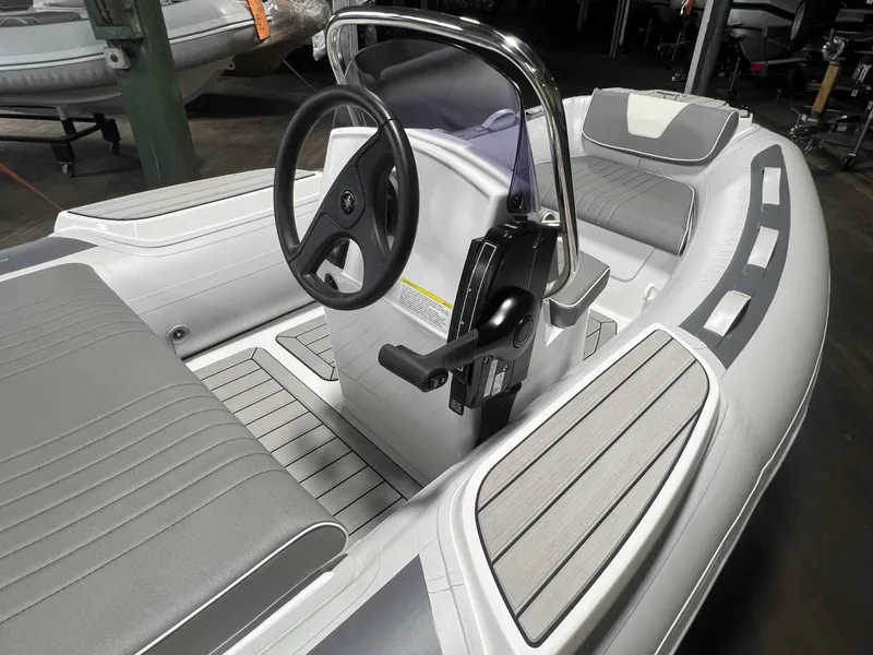 Slide: The Image of 2026 Gala V330 inflatable boat in a warehouse setting, showcasing sleek design and modern features. - 2