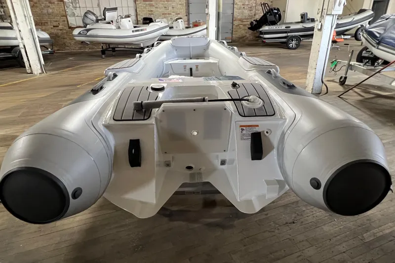 Slide: The Image of 2026 Gala V330 inflatable boat in a showroom, showcasing its sleek design and features. - 7