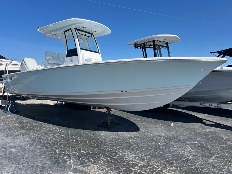 The Image of 2025 Sportsman Masters 267OE Bay Boat displayed on a sunny day. - 0