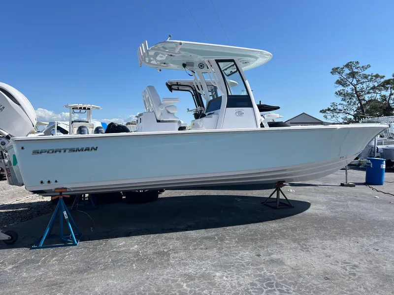 Slide: The Image of 2025 Sportsman Masters 267OE Bay Boat on display, side view, outdoors. - 2