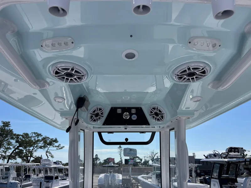 Slide: The Image of 2025 Sportsman Masters 267OE Bay Boat interior with speakers and control panel. - 20