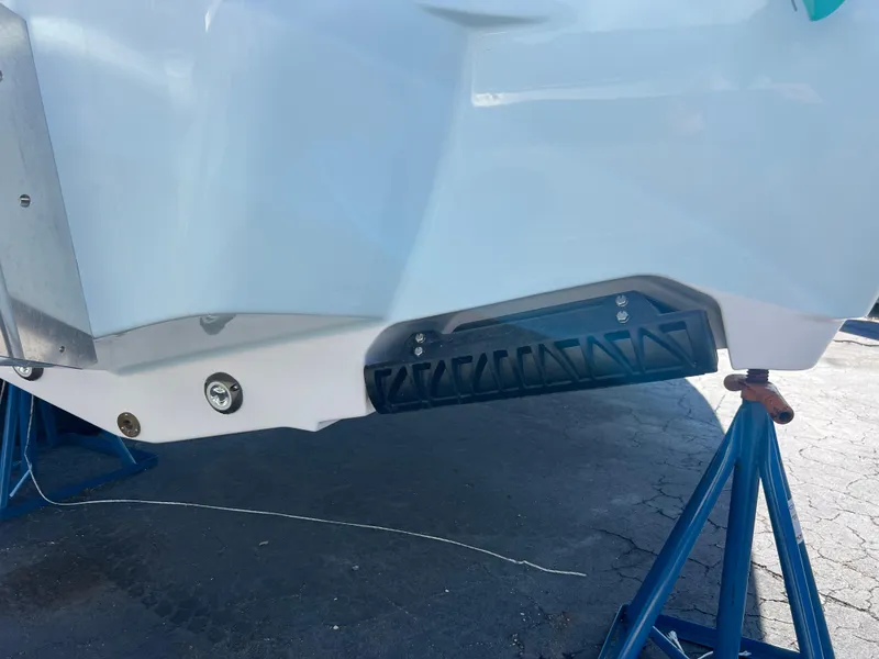 Slide: The Image of 2025 Sportsman Masters 267OE Bay Boat hull on stands, showcasing sleek design and craftsmanship. - 6