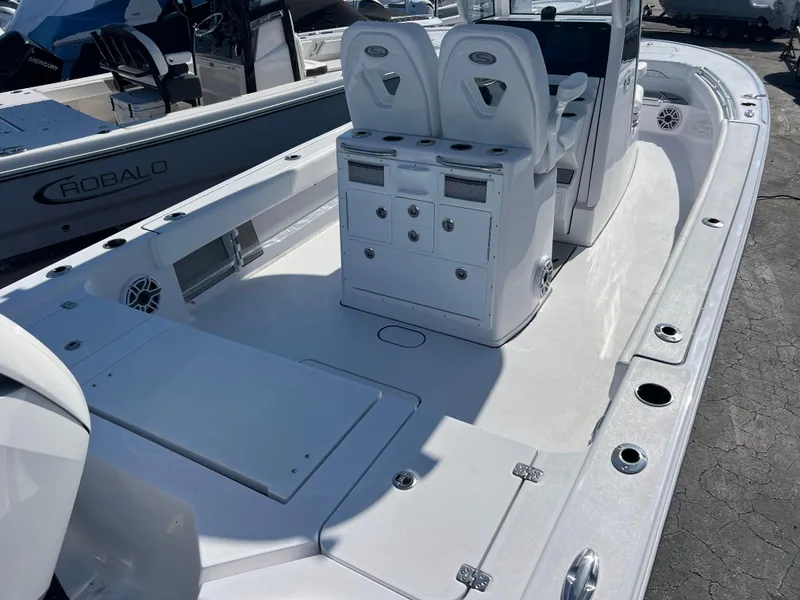 Slide: The Image of 2025 Sportsman Masters 267OE Bay Boat interior with seating and storage compartments. - 7
