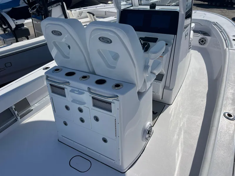 Slide: The Image of 2025 Sportsman Masters 267OE Bay Boat interior with dual seats and control panel. - 8