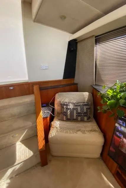 Slide: The Image of Interior of 2002 Silverton 453 Motor Yacht with cozy seating and decorative pillow. - 16