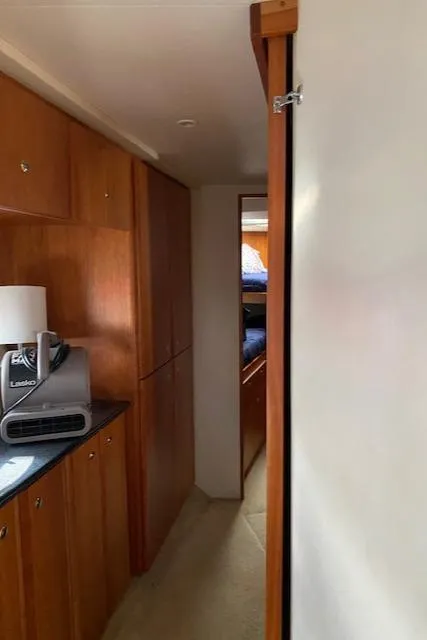 Slide: The Image of Interior hallway of 2002 Silverton 453 Motor Yacht with wooden cabinetry. - 20