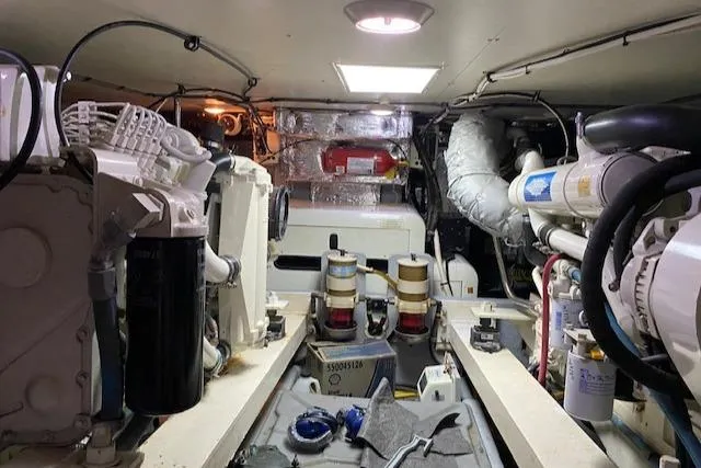 Slide: The Image of Engine room of a 2002 Silverton 453 Motor Yacht, showcasing mechanical components and equipment. - 25