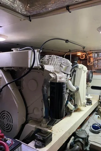 Slide: The Image of Engine room of a 2002 Silverton 453 Motor Yacht, showcasing mechanical components. - 26