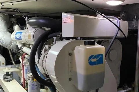 Slide: The Image of Engine room of 2002 Silverton 453 Motor Yacht, showcasing mechanical components and systems. - 27