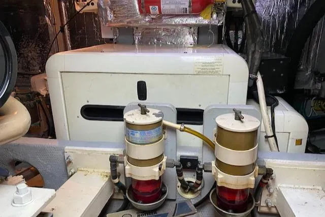 Slide: The Image of Engine room of 2002 Silverton 453 Motor Yacht with fuel filters and equipment. - 28