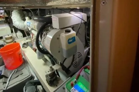 Slide: The Image of Engine room of a 2002 Silverton 453 Motor Yacht, featuring mechanical components and equipment. - 33