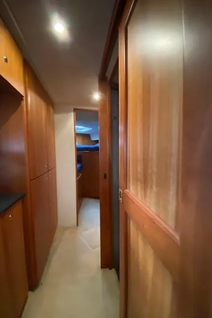 Slide: The Image of Interior hallway of 2002 Silverton 453 Motor Yacht with wooden cabinetry. - 36