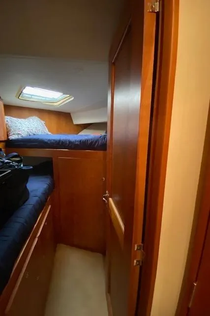 Slide: The Image of Interior cabin of 2002 Silverton 453 Motor Yacht with wooden finish and skylight. - 38