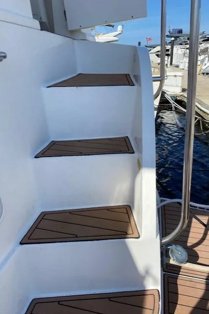 Slide: The Image of Staircase on a 2002 Silverton 453 Motor Yacht, leading to the deck. - 4