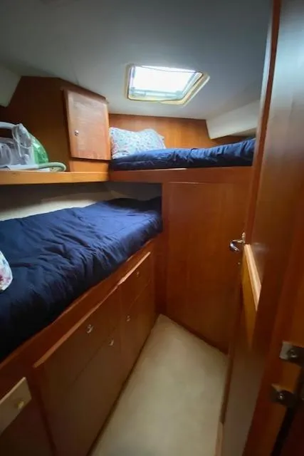 Slide: The Image of Interior cabin of 2002 Silverton 453 Motor Yacht with bunk beds and wooden cabinetry. - 40