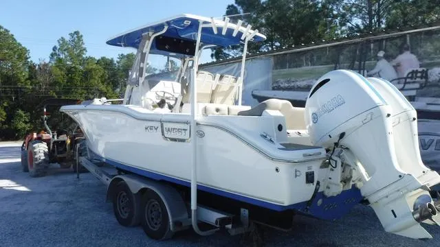 Slide: The Image of 2021 Key West 263FS boat on trailer with Yamaha outboard motor. - 1