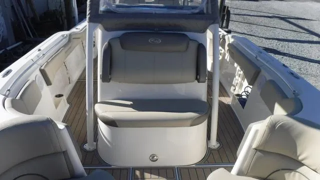 Slide: The Image of 2021 Key West 263FS boat interior with seating and deck view. - 12