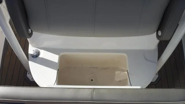 Slide: The Image of 2021 Key West 263FS boat seating area with storage compartment. - 14