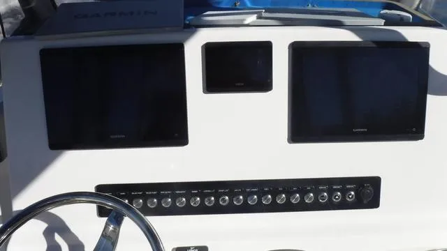 Slide: The Image of Dashboard of 2021 Key West 263FS boat with Garmin displays and control panel. - 20