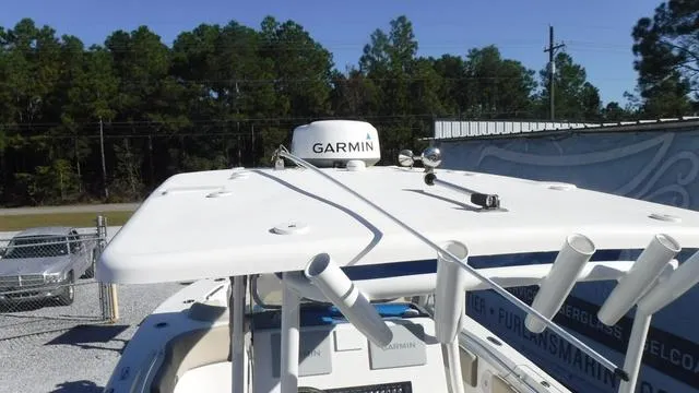 Slide: The Image of 2021 Key West 263FS boat with Garmin radar, docked outdoors. - 25