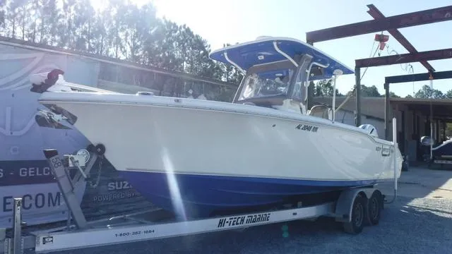 Slide: The Image of 2021 Key West 263FS boat on trailer, parked outdoors. - 3