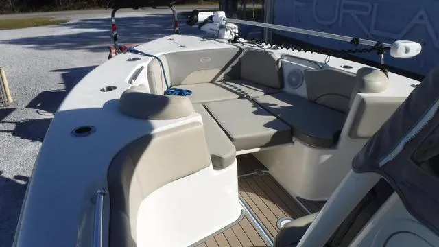 Slide: The Image of 2021 Key West 263FS boat interior with cushioned seating and deck. - 9