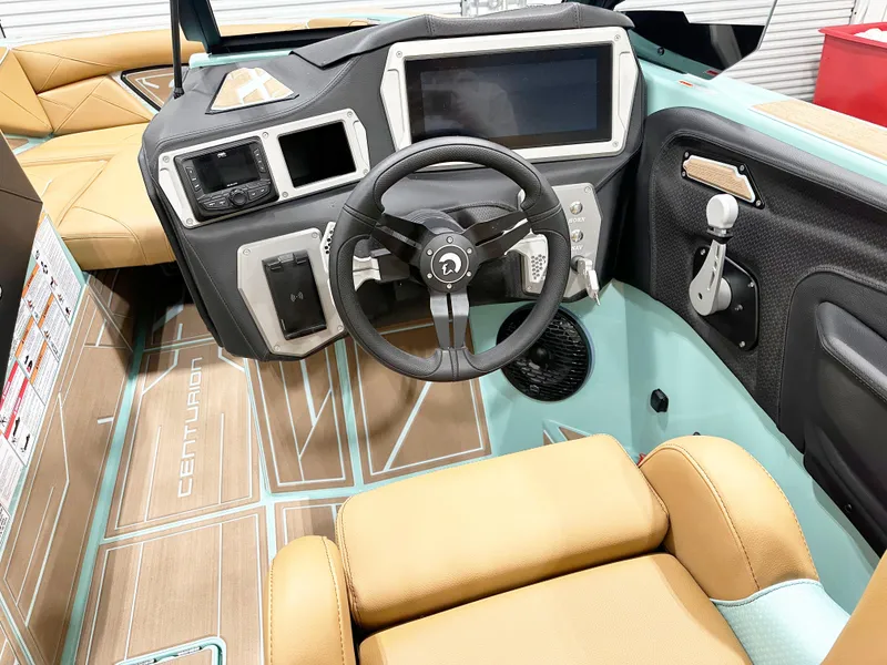Slide: The Image of Interior of 2025 Centurion NV233 boat with modern dashboard and steering wheel. - 8