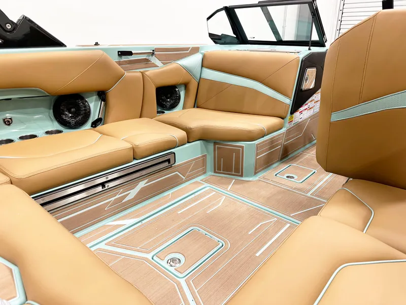 Slide: The Image of Luxurious interior of 2025 Centurion NV233 boat with tan and aqua seating. - 9