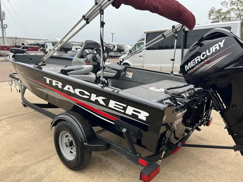Slide: The Image of 2018 Tracker Pro Guide V-16 SC boat with Mercury engine on trailer. - 2