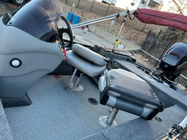 Slide: The Image of 2018 Tracker Pro Guide V-16 SC boat interior with steering console and seating. - 5