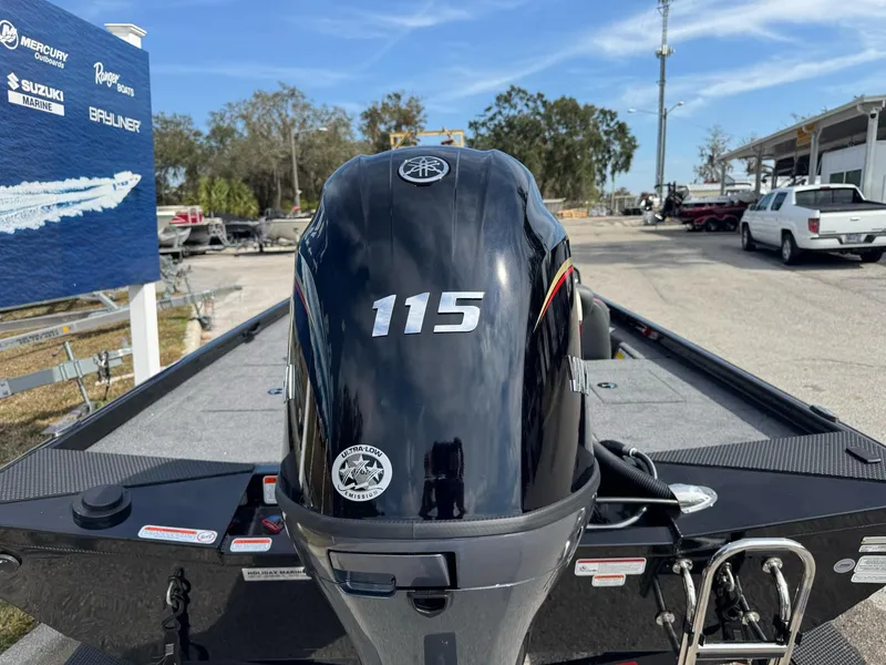 Slide: The Image of 2025 Ranger RT188C boat with 115 horsepower engine, parked outdoors. - 10