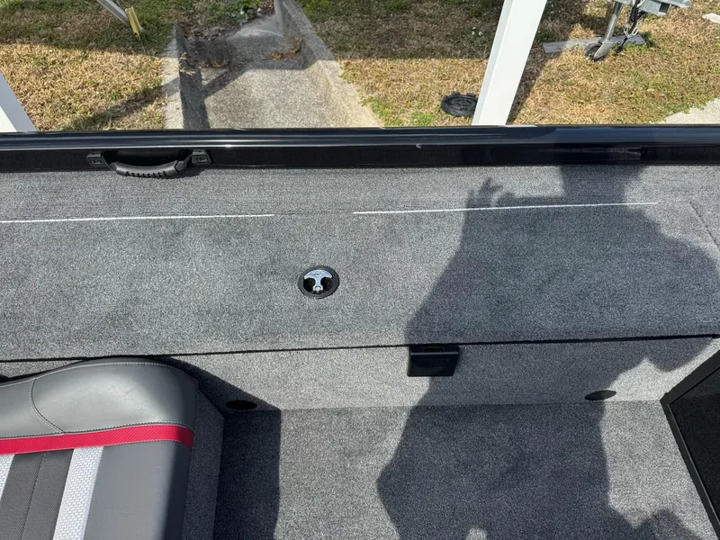 Slide: The Image of 2025 Ranger RT188C boat interior with gray carpet and seating. - 6