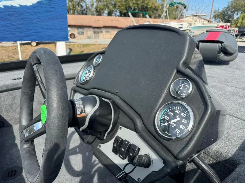 Slide: The Image of Dashboard of a 2025 Ranger RT188C boat with steering wheel and gauges. - 9