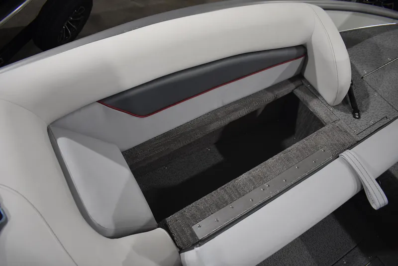 Slide: The Image of 2025 Lowe SD224 Sport Deck interior seating with storage compartment. - 13