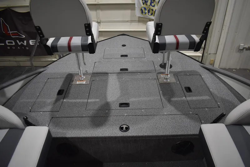 Slide: The Image of 2025 Lowe SD224 Sport Deck interior with seating and storage compartments. - 18