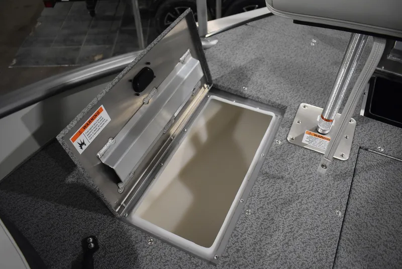 Slide: The Image of 2025 Lowe SD224 Sport Deck boat storage compartment with open lid, showcasing interior space. - 19